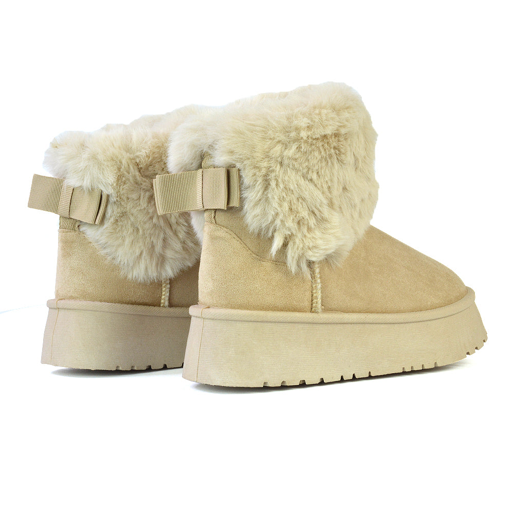 Winnie Platform Faux Fur Ankle Boots with Bow Detailing in Beige